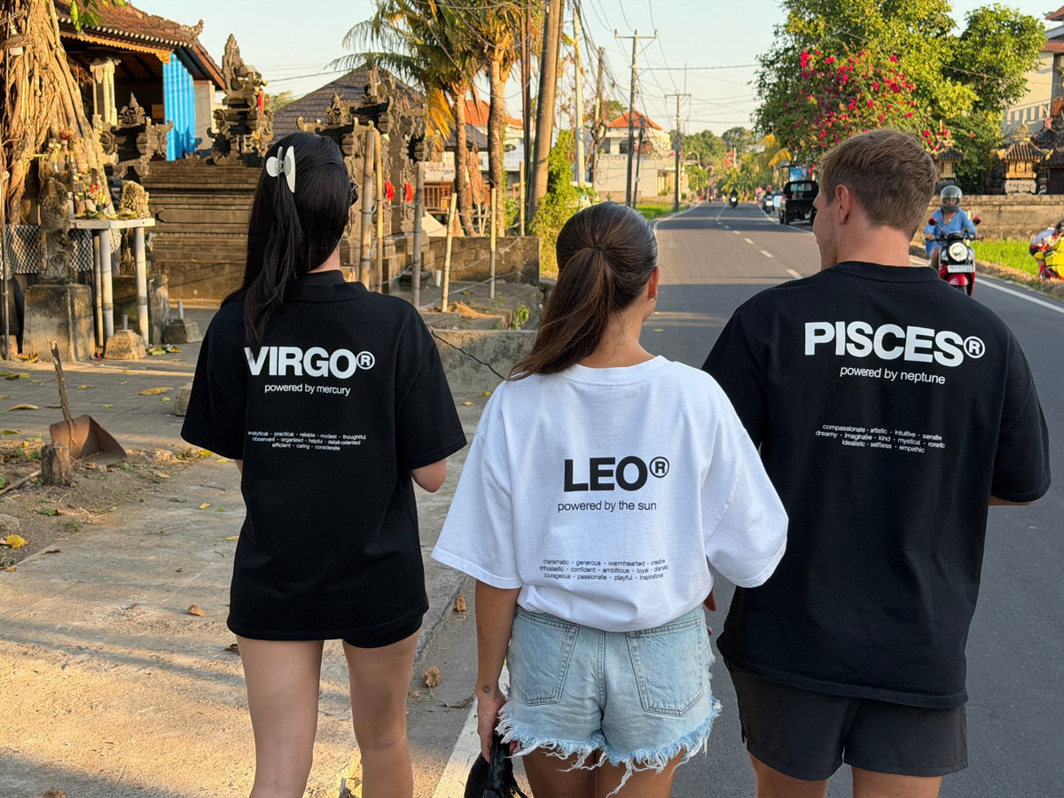 friends wearing their signs on a sunset walk in Bali